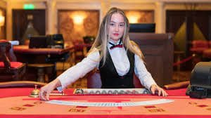 skolah toto mobile app login screen and live-dealer casino interface on Android phone